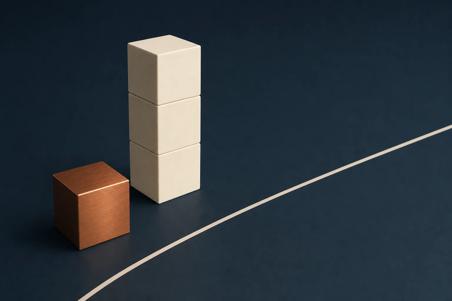 A single brushed copper cube beside a stack of three ivory cubes on a navy floor divided by a pale inlaid boundary line