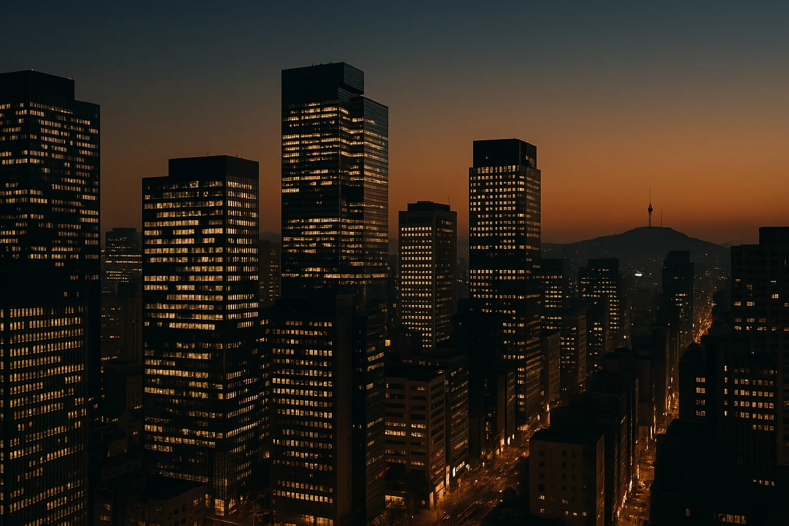 Seoul's Gangnam business district at dusk, office towers lit against a navy sky