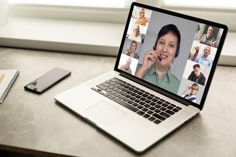 Group Friends Video Chat Connection Concept. Laptop on table, home interior